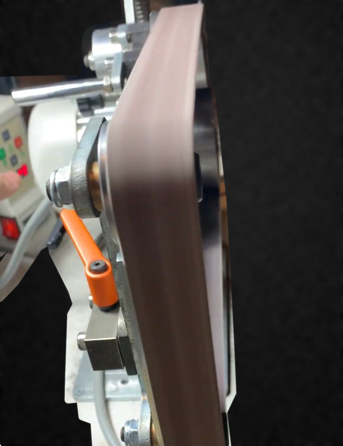 Belt grinder in the workshop